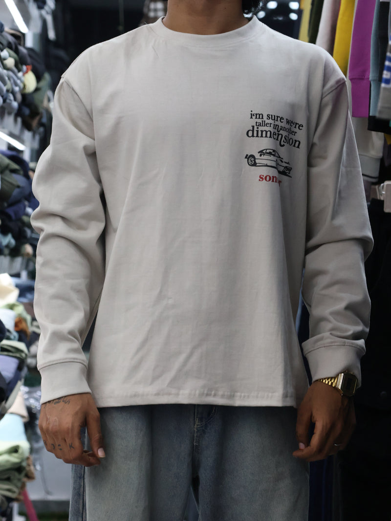 This long-sleeve black tee features bold typography and a relaxed, street-ready silhouette.