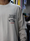 This long-sleeve black tee features bold typography and a relaxed, street-ready silhouette.