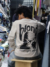 This long-sleeve black tee features bold typography and a relaxed, street-ready silhouette.