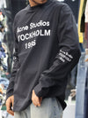 This long-sleeve black tee features bold typography and a relaxed, street-ready silhouette.