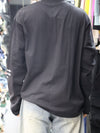 This long-sleeve black tee features bold typography and a relaxed, street-ready silhouette.